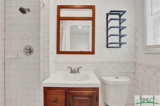 13 Burnt Tree Rd, Savannah, GA 31419 - full bath featuring a tile shower, vanity, tile walls, and wainscoting