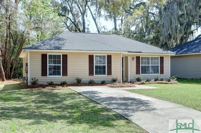 single story home with driveway, roof with shingles, and a front lawn