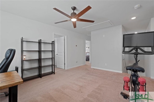 interior space featuring attic access, ceiling fan, baseboards, and carpet flooring