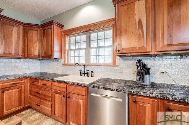 kitchen featuring a sink, brown cabinetry, tasteful backsplash, and dishwasher