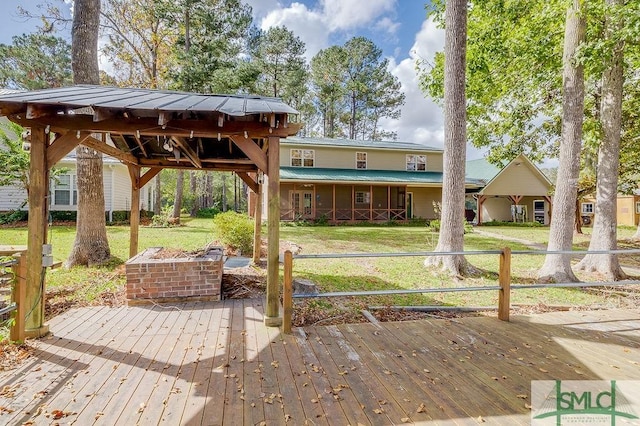 wooden deck featuring a yard