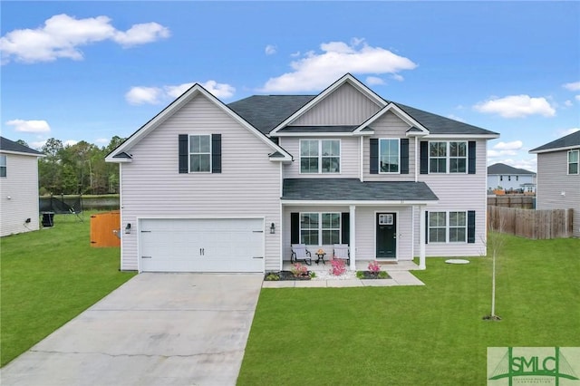 31 Fridley Ln, Hinesville, GA 31313 - view of front of home featuring board and batten siding, a front lawn, fence, and concrete driveway