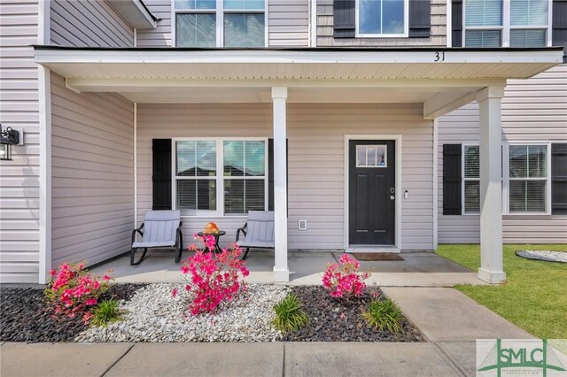31 Fridley Ln, Hinesville, GA 31313 - property entrance featuring a porch