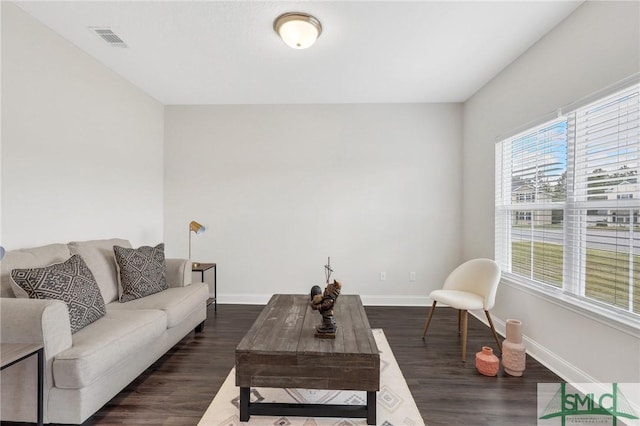 31 Fridley Ln, Hinesville, GA 31313 - living area featuring visible vents, baseboards, and dark wood finished floors