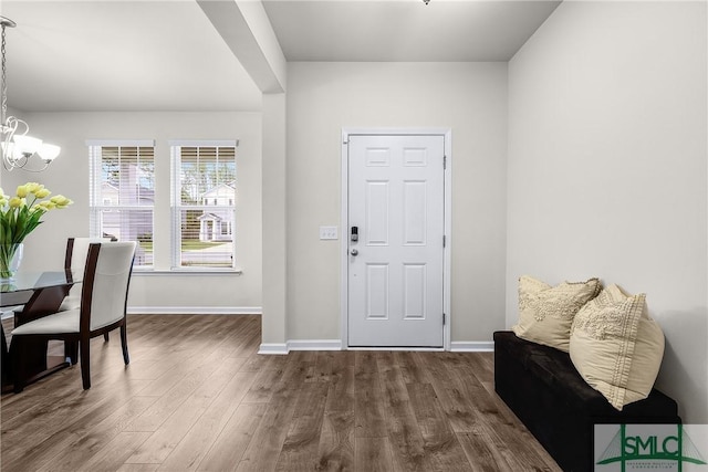 224 Benelli Dr, Pooler, GA 31322 - foyer entrance featuring a chandelier, baseboards, and dark wood finished floors