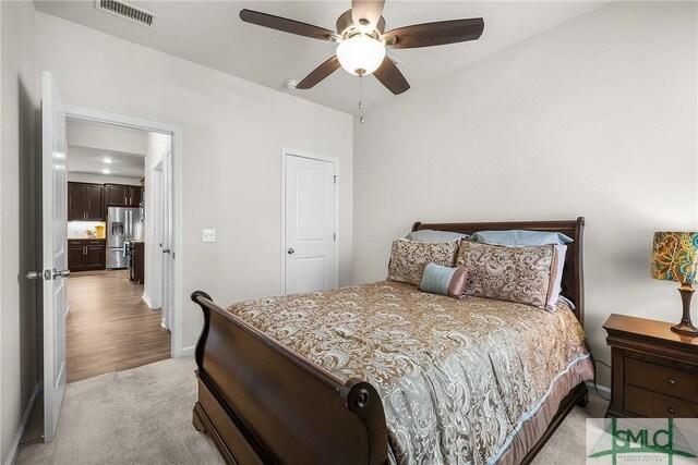 224 Benelli Dr, Pooler, GA 31322 - bedroom featuring light colored carpet, a ceiling fan, visible vents, stainless steel refrigerator with ice dispenser, and baseboards