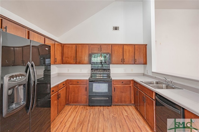 28 Raven Wood Way, Pooler, GA 31322 - kitchen featuring a sink, black appliances, and brown cabinets