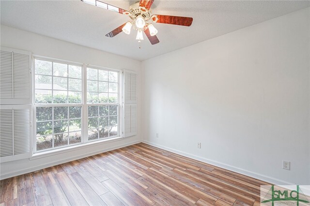 28 Raven Wood Way, Pooler, GA 31322 - unfurnished room with baseboards, ceiling fan, wood finished floors, and a textured ceiling