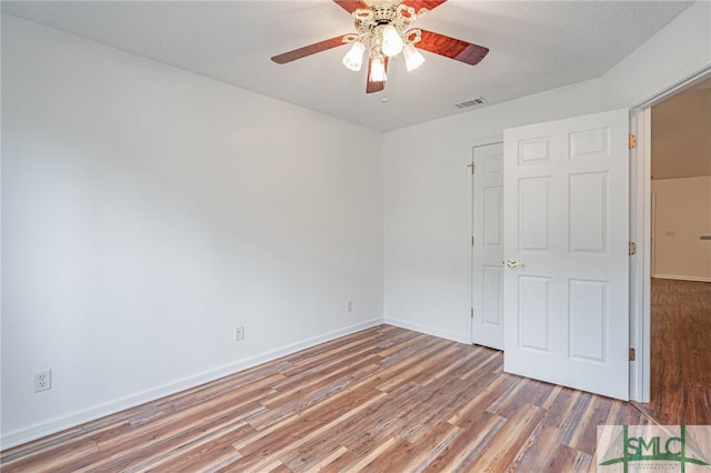 28 Raven Wood Way, Pooler, GA 31322 - unfurnished bedroom featuring wood finished floors, ceiling fan, baseboards, and visible vents