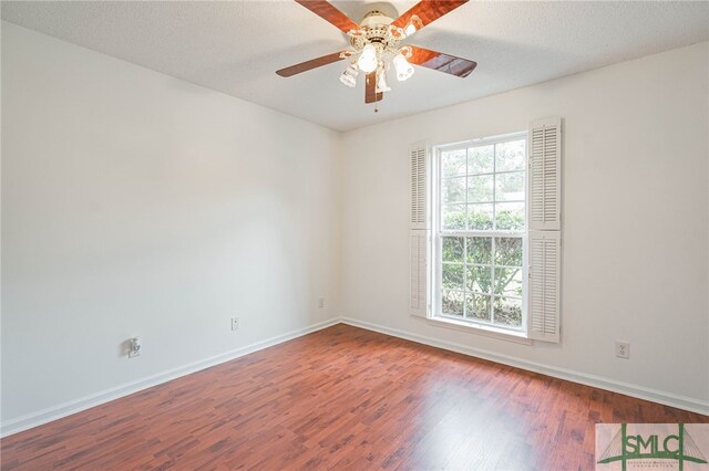 28 Raven Wood Way, Pooler, GA 31322 - empty room with a textured ceiling, baseboards, a ceiling fan, and wood finished floors