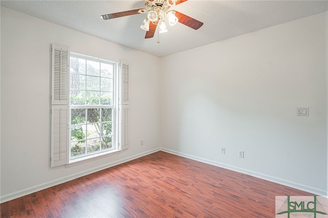 28 Raven Wood Way, Pooler, GA 31322 - empty room with a wealth of natural light, baseboards, and wood finished floors