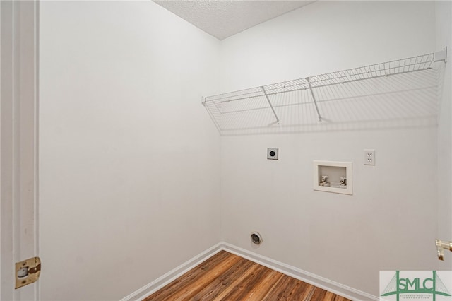 28 Raven Wood Way, Pooler, GA 31322 - clothes washing area with hookup for an electric dryer, baseboards, washer hookup, laundry area, and wood finished floors