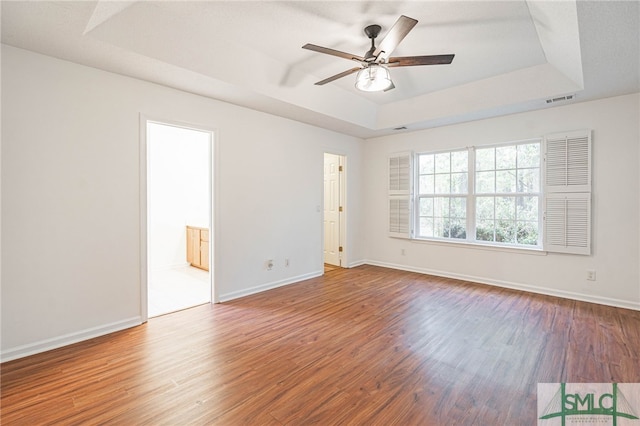 28 Raven Wood Way, Pooler, GA 31322 - unfurnished room featuring visible vents, baseboards, a raised ceiling, and wood finished floors
