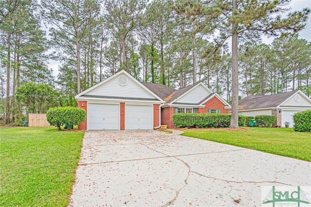 28 Raven Wood Way, Pooler, GA 31322 - view of front of house with brick siding, a front yard, a garage, and concrete driveway