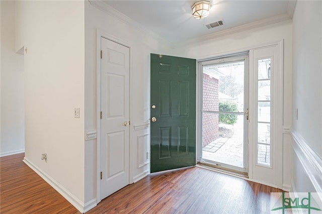 28 Raven Wood Way, Pooler, GA 31322 - foyer entrance featuring wood finished floors, baseboards, ornamental molding, and visible vents