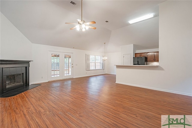 28 Raven Wood Way, Pooler, GA 31322 - unfurnished living room with visible vents, light wood-style floors, a fireplace, ceiling fan with notable chandelier, and high vaulted ceiling