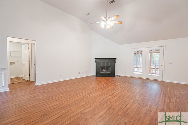28 Raven Wood Way, Pooler, GA 31322 - unfurnished living room featuring high vaulted ceiling, light wood-style flooring, a ceiling fan, a tiled fireplace, and baseboards