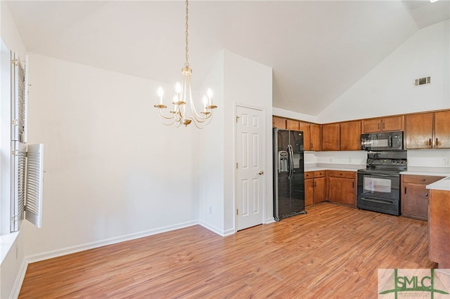 28 Raven Wood Way, Pooler, GA 31322 - kitchen featuring an inviting chandelier, light countertops, visible vents, brown cabinetry, and black appliances