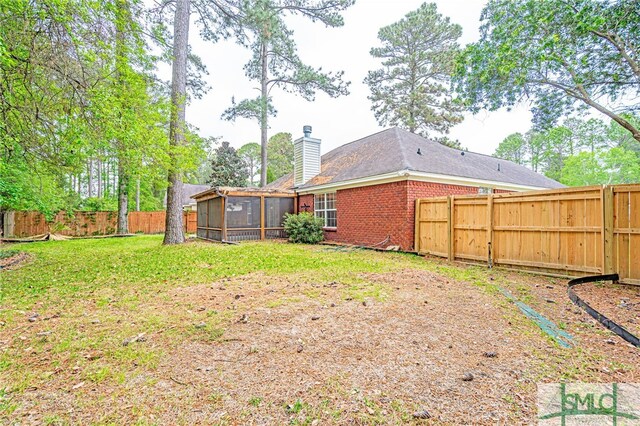 28 Raven Wood Way, Pooler, GA 31322 - view of yard with a sunroom and a fenced backyard
