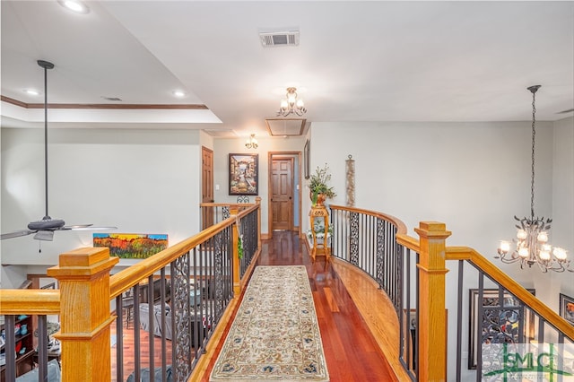 57 Delegal Rd, Savannah, GA 31411 - corridor featuring visible vents, an upstairs landing, an inviting chandelier, and wood finished floors