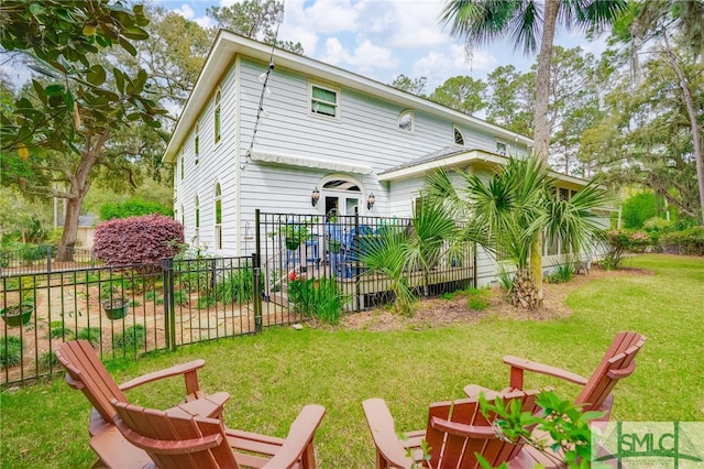 57 Delegal Rd, Savannah, GA 31411 - rear view of property featuring a yard and fence