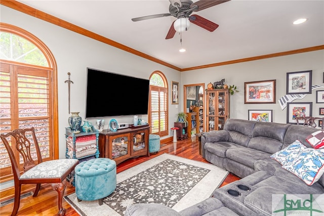 57 Delegal Rd, Savannah, GA 31411 - living area with wood finished floors, ceiling fan, ornamental molding, and a wealth of natural light