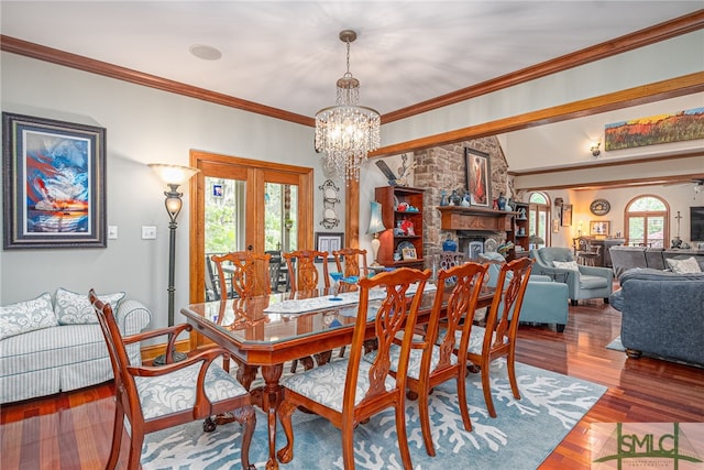 57 Delegal Rd, Savannah, GA 31411 - dining room with a notable chandelier, french doors, crown molding, lofted ceiling, and wood finished floors