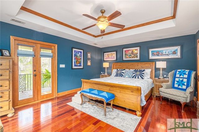 57 Delegal Rd, Savannah, GA 31411 - bedroom featuring access to outside, visible vents, wood finished floors, a raised ceiling, and french doors
