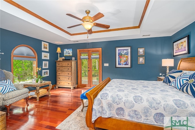 57 Delegal Rd, Savannah, GA 31411 - bedroom with visible vents, a raised ceiling, ornamental molding, wood finished floors, and access to exterior