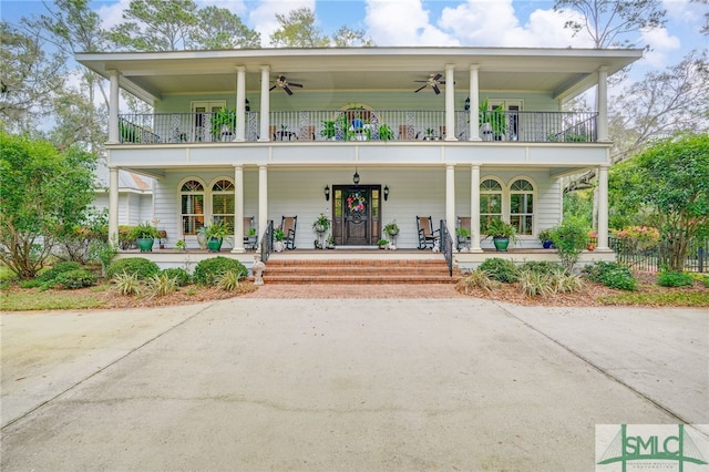 57 Delegal Rd, Savannah, GA 31411 - view of front of home with a porch, a ceiling fan, and a balcony
