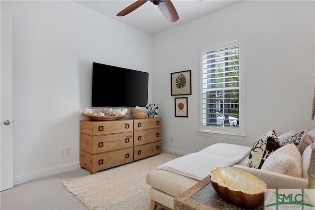 carpeted bedroom featuring baseboards and ceiling fan