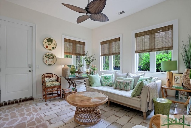 interior space featuring visible vents and ceiling fan