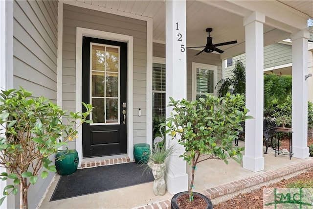 doorway to property with a ceiling fan and covered porch