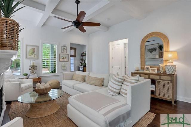 living room with dark wood-type flooring, a ceiling fan, beam ceiling, and coffered ceiling