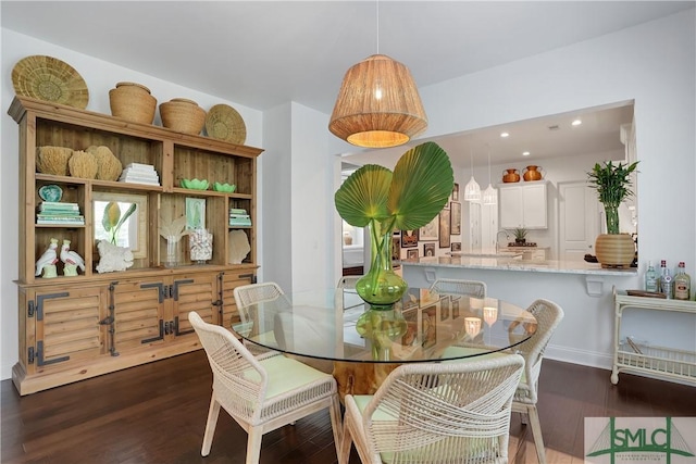 dining space featuring recessed lighting and dark wood-style floors