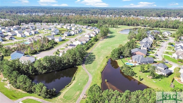 drone / aerial view featuring a water view, golf course view, and a residential view