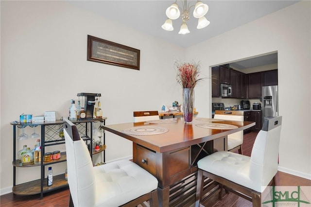 dining room with dark wood-style flooring, baseboards, and an inviting chandelier