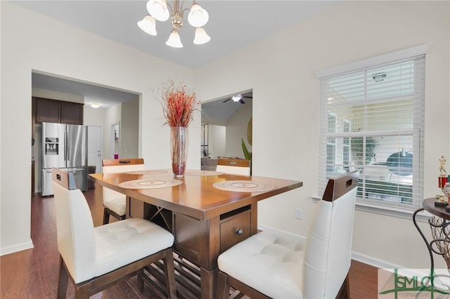 dining area with a notable chandelier, dark wood finished floors, and baseboards