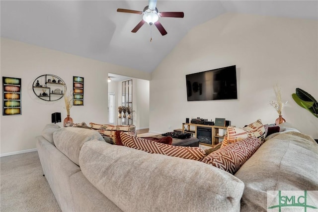 carpeted living area with baseboards, vaulted ceiling, and a ceiling fan