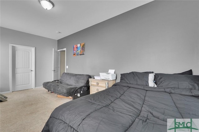 carpeted bedroom with baseboards