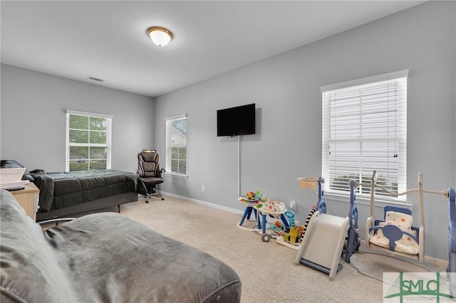 bedroom featuring carpet, visible vents, and baseboards