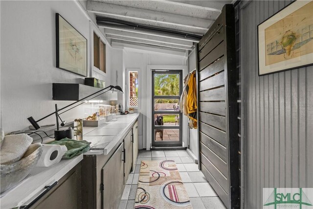 109 Seminole St, Savannah, GA 31406 - bar with vaulted ceiling and light tile patterned flooring