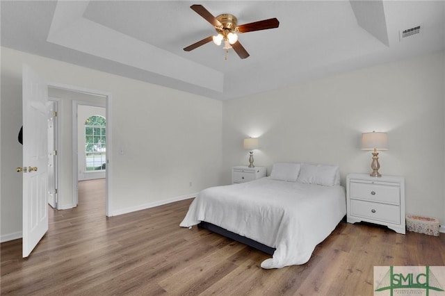 2 Finch Ct, Savannah, GA 31419 - bedroom with a raised ceiling, wood finished floors, and baseboards