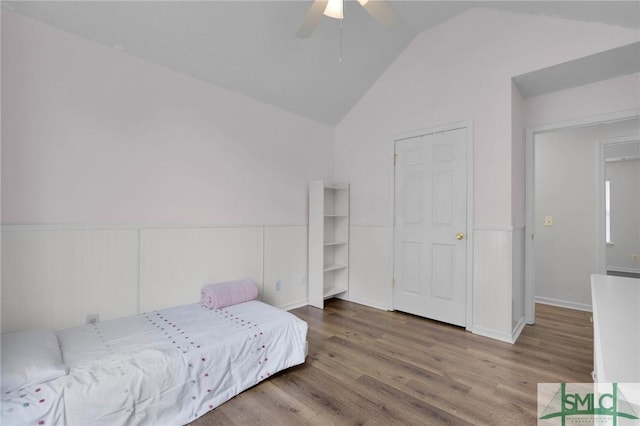 2 Finch Ct, Savannah, GA 31419 - bedroom with wainscoting, vaulted ceiling, wood finished floors, and ceiling fan