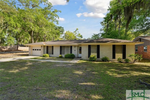 ranch-style house with concrete driveway, a front yard, brick siding, and an attached garage