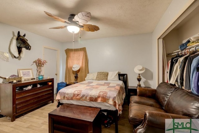130 N Leeds Gate Rd, Savannah, GA 31406 - bedroom featuring light wood-style floors, a textured ceiling, and a ceiling fan