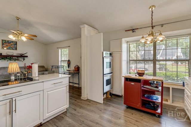 130 N Leeds Gate Rd, Savannah, GA 31406 - kitchen with stainless steel double oven, light wood finished floors, a ceiling fan, white cabinets, and vaulted ceiling