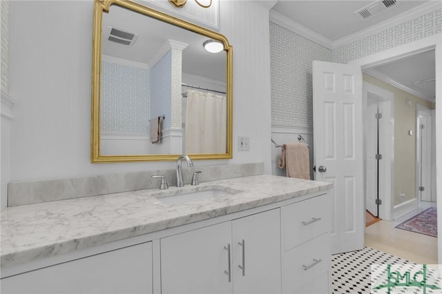bathroom with crown molding, vanity, and curtained shower