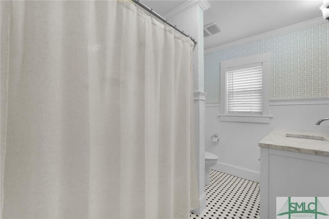 full bathroom with ornamental molding, toilet, wallpapered walls, tile patterned floors, and vanity