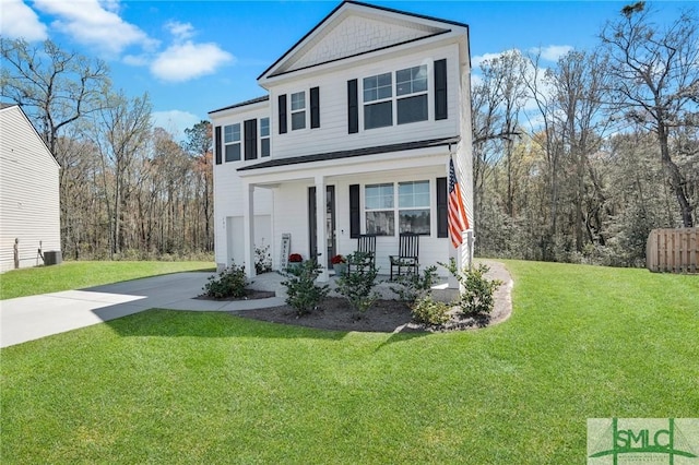 view of front facade with central air condition unit, covered porch, a front yard, and driveway